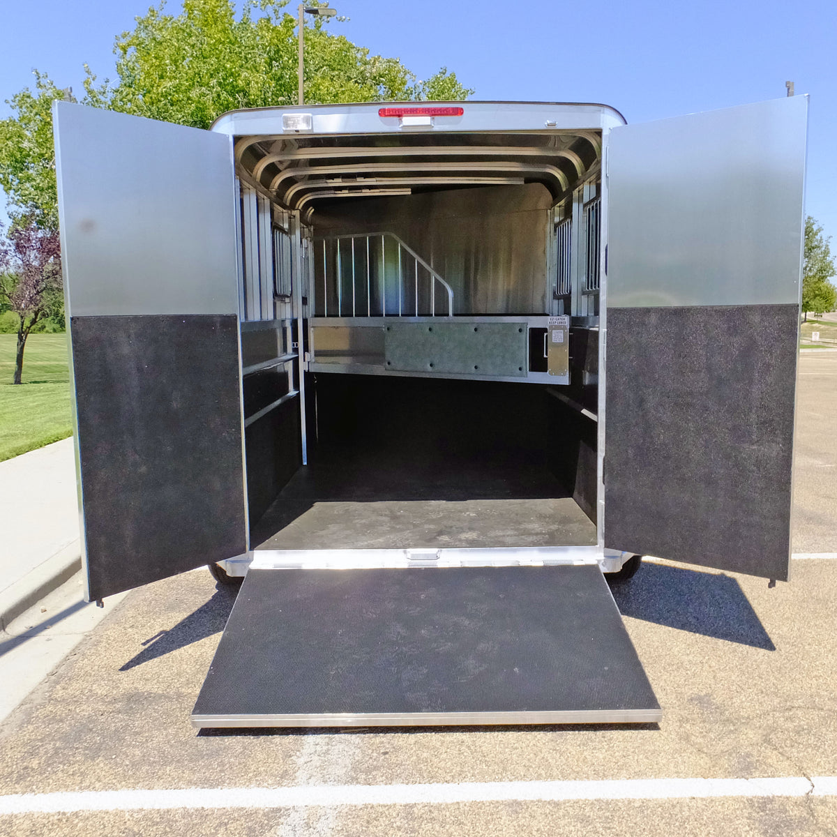 Aluminum rear load ramp fitted to a Maverick horse trailer